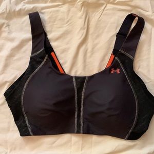 Women’s Under Armour 38D black with orange trim sports bra.